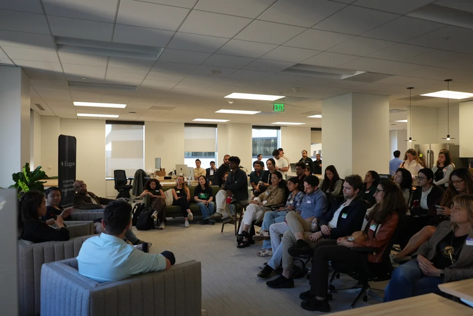 Audience members seated around the panel at Eragon's office.